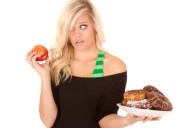 woman with apple want donut
